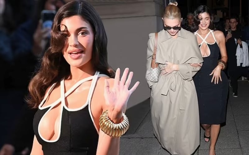 Cover Image for Kylie Jenner flaunts her hourglass figure in a busty black dress as she joins her chic sister Kendall at Schiaparelli’s Paris Fashion Week show